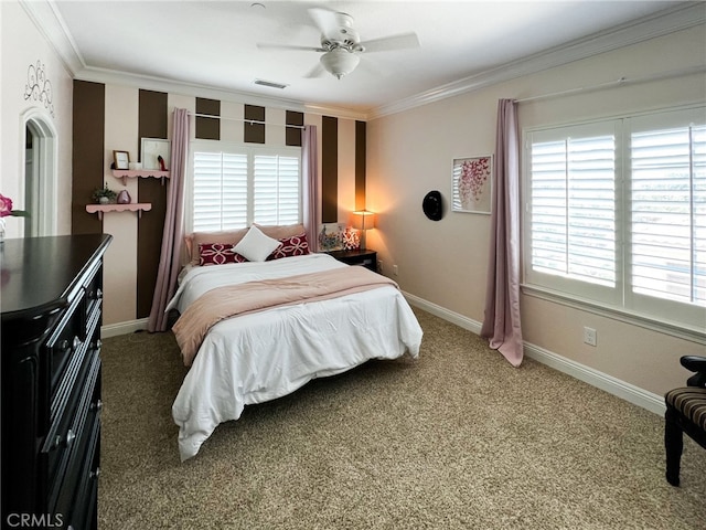 bedroom featuring crown molding, carpet flooring, and ceiling fan