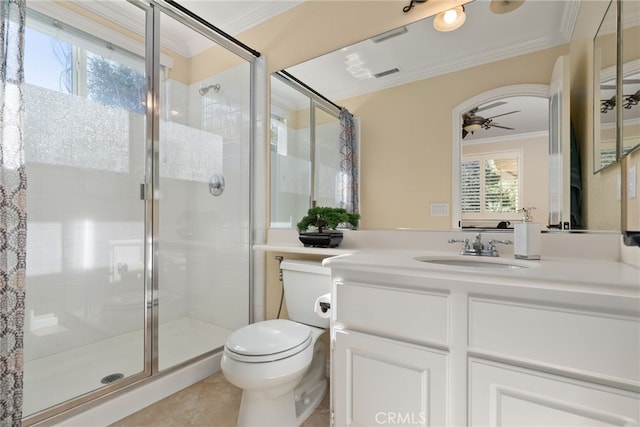 bathroom featuring vanity, toilet, ornamental molding, and a shower with door