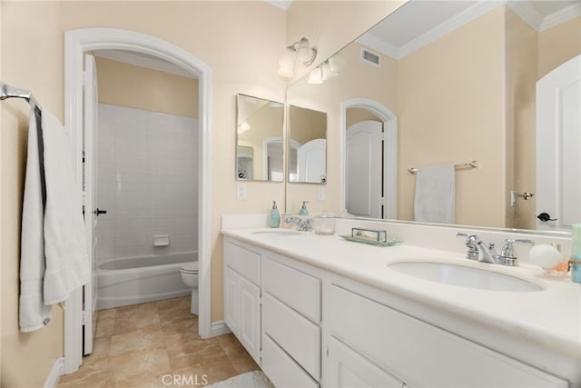 full bathroom with toilet, ornamental molding, vanity, tiled shower / bath combo, and tile patterned floors