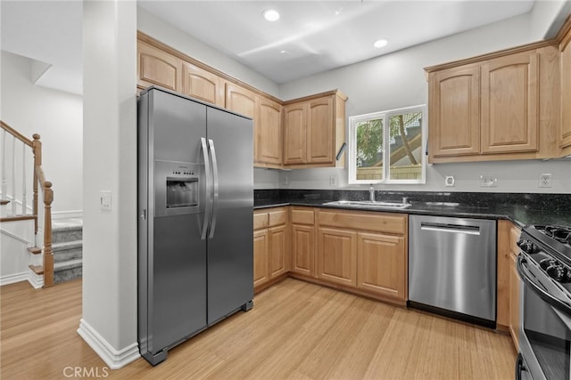 328 E Imperial Ave Unit 1, El Segundo, CA 90245 - kitchen with stainless steel appliances, a sink, light wood-type flooring, recessed lighting, and dark stone counters