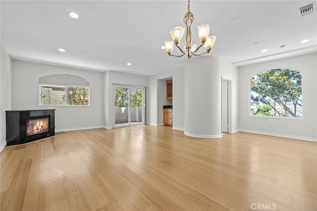 328 E Imperial Ave Unit 1, El Segundo, CA 90245 - unfurnished living room with a multi sided fireplace, light wood finished floors, a chandelier, recessed lighting, and baseboards
