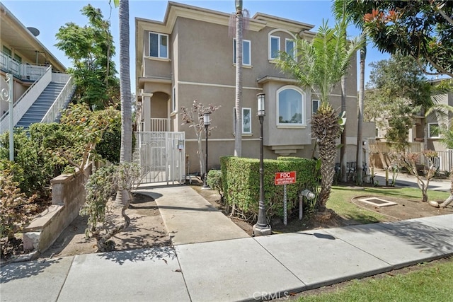 328 E Imperial Ave Unit 1, El Segundo, CA 90245 - multi unit property featuring stucco siding and a gate