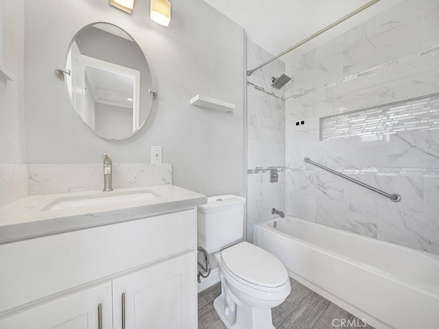 bathroom featuring toilet, tub / shower combination, and vanity