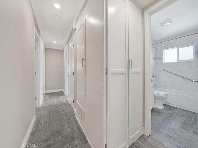 corridor featuring ornamental molding, recessed lighting, and baseboards