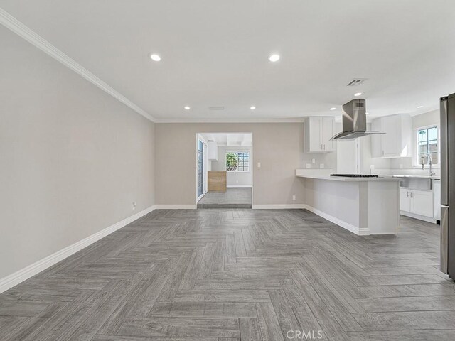 unfurnished living room featuring parquet flooring and ornamental molding