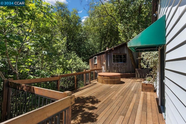 deck with a hot tub