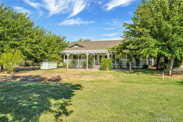 view of yard with a porch and a shed