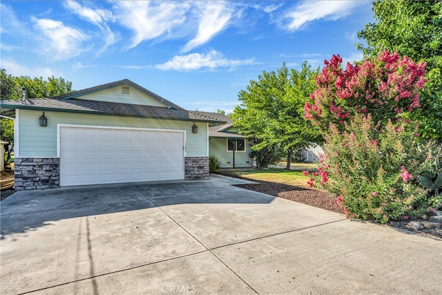 ranch-style home featuring a garage