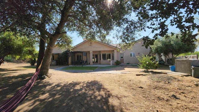 back of house featuring a patio