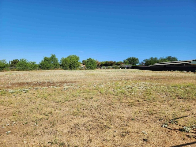 view of yard with a rural view