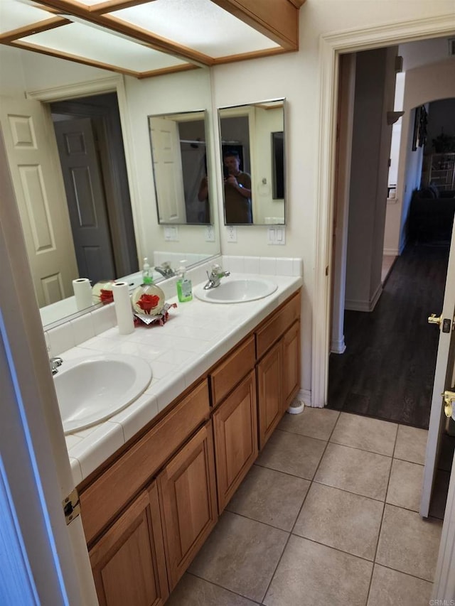 bathroom featuring tile patterned flooring and vanity