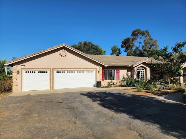 ranch-style house with a garage