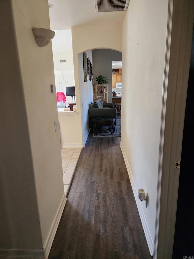 hallway featuring wood-type flooring