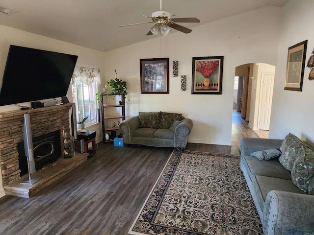 living room with ceiling fan, lofted ceiling, and hardwood / wood-style flooring