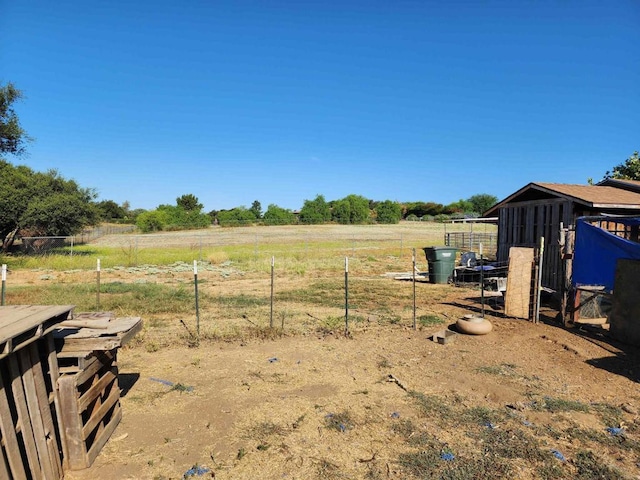 view of yard with a rural view