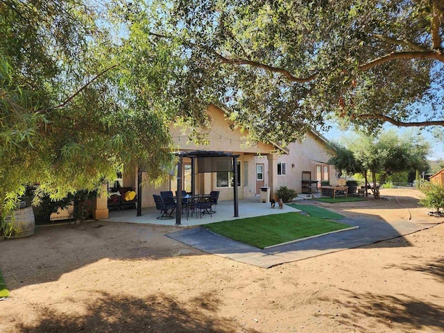 back of house with a patio area