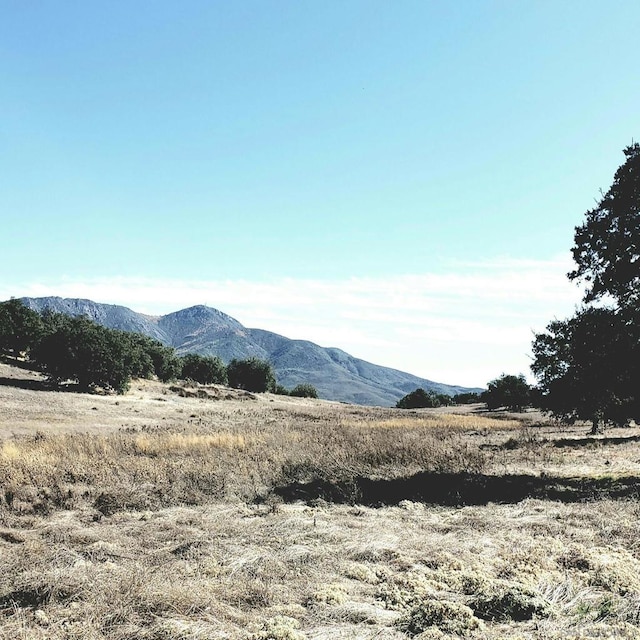 mountain view featuring a rural view