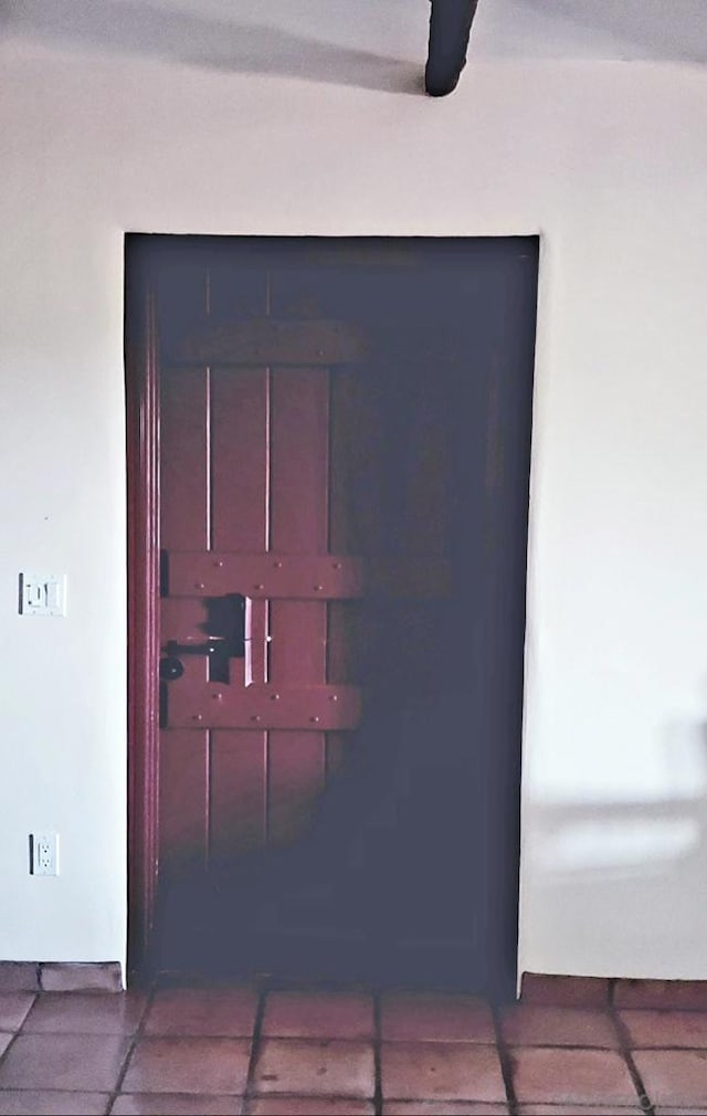 interior details featuring tile patterned flooring