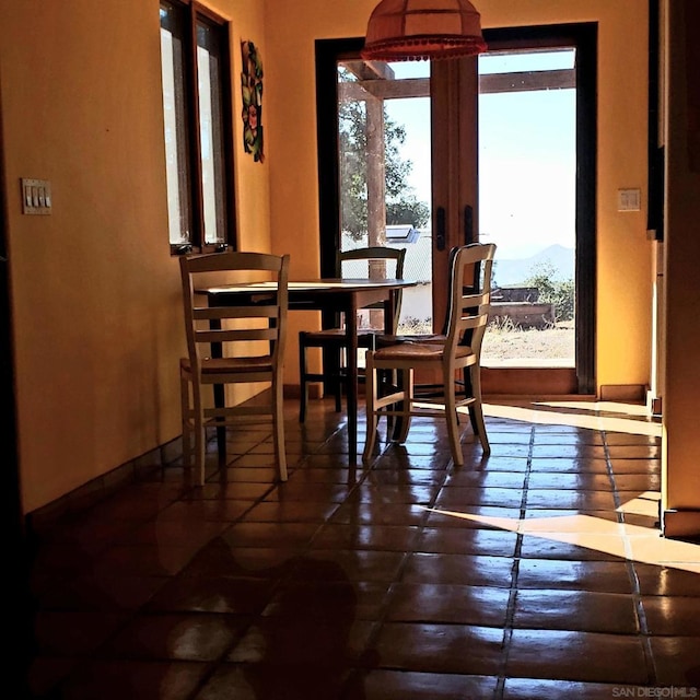 dining room featuring a mountain view