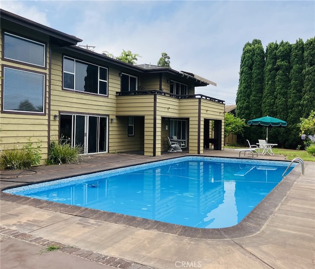 view of pool featuring a patio