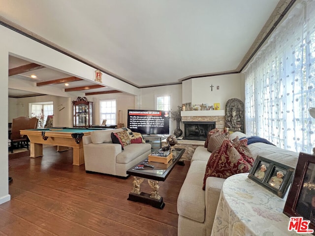 living room with pool table, beam ceiling, wood-type flooring, crown molding, and a fireplace