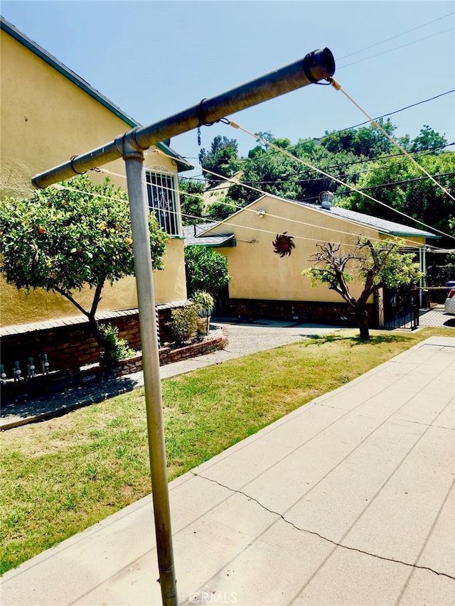 view of property exterior featuring a lawn