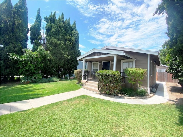 view of front of home featuring a porch and a front lawn