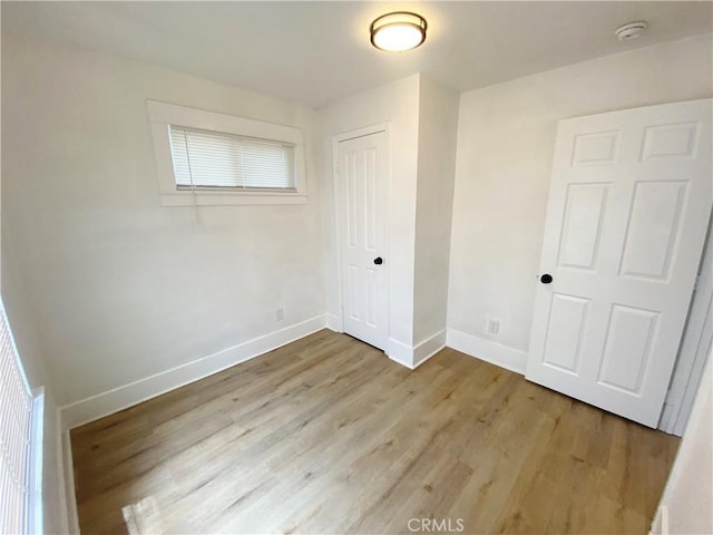 empty room with light wood-type flooring