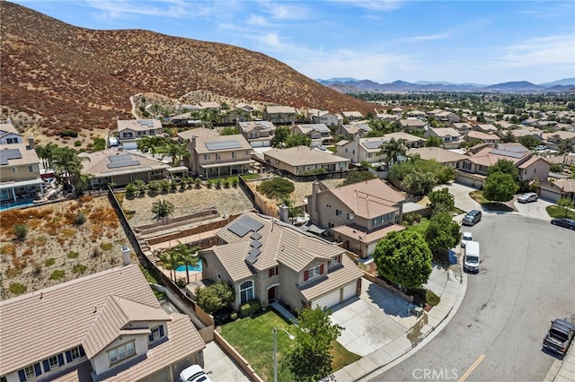 birds eye view of property featuring a mountain view