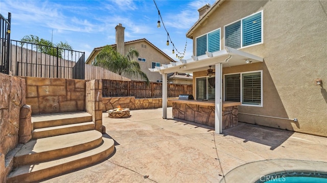 view of patio featuring an outdoor fire pit