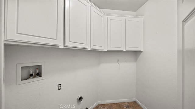 washroom with cabinets and hookup for a washing machine