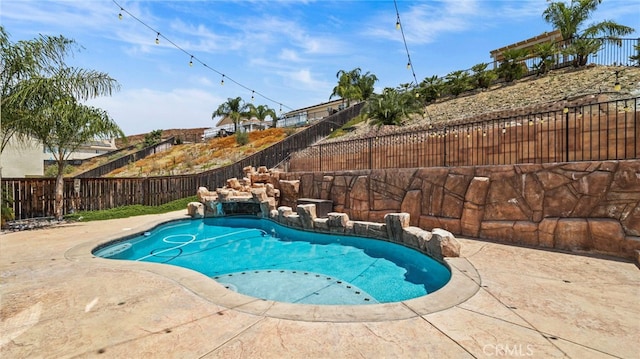 view of swimming pool featuring a patio