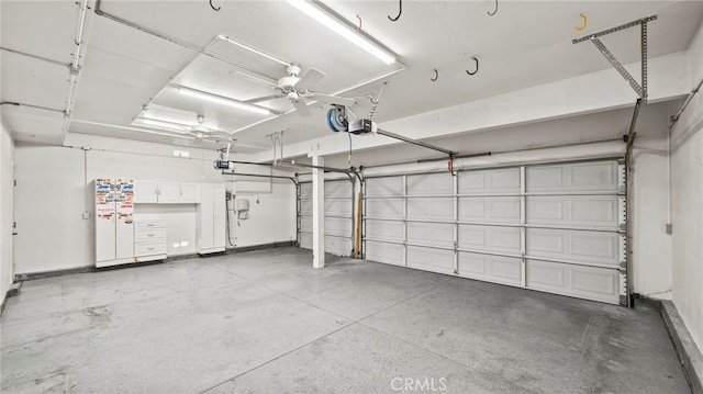 garage featuring ceiling fan and a garage door opener