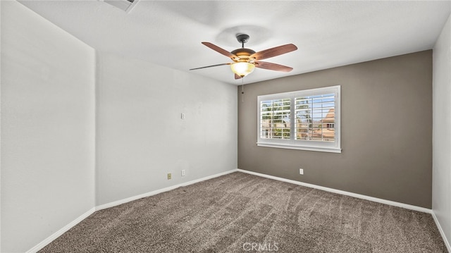 unfurnished room with ceiling fan and carpet flooring