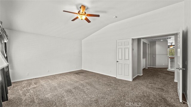 additional living space with vaulted ceiling, ceiling fan, and dark carpet