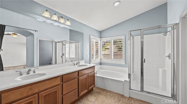 bathroom featuring independent shower and bath, lofted ceiling, vanity, and tile patterned flooring