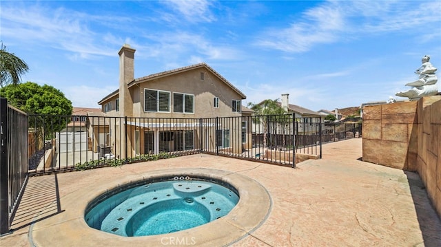 view of pool featuring an in ground hot tub and a patio area