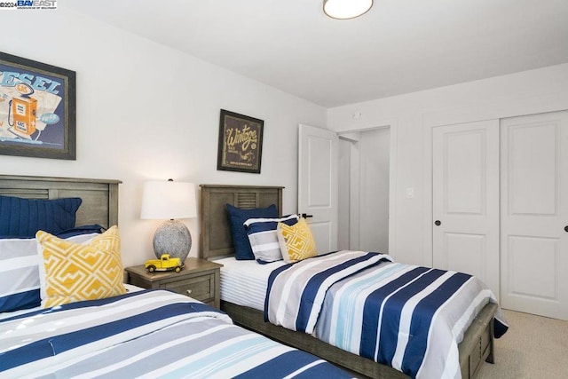 carpeted bedroom featuring a closet