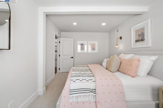 bedroom featuring light colored carpet