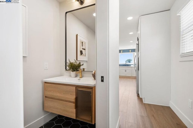 bathroom with wood-type flooring and vanity