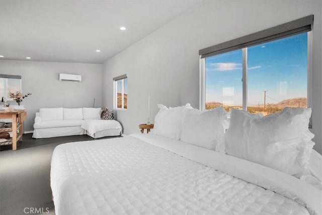bedroom featuring recessed lighting, multiple windows, and a wall unit AC