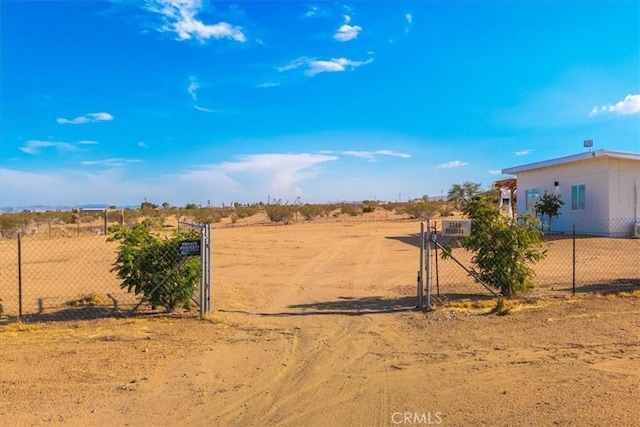 view of yard with a gate and fence