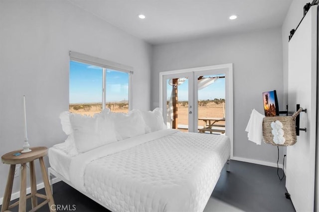 bedroom with recessed lighting, a barn door, access to exterior, baseboards, and french doors
