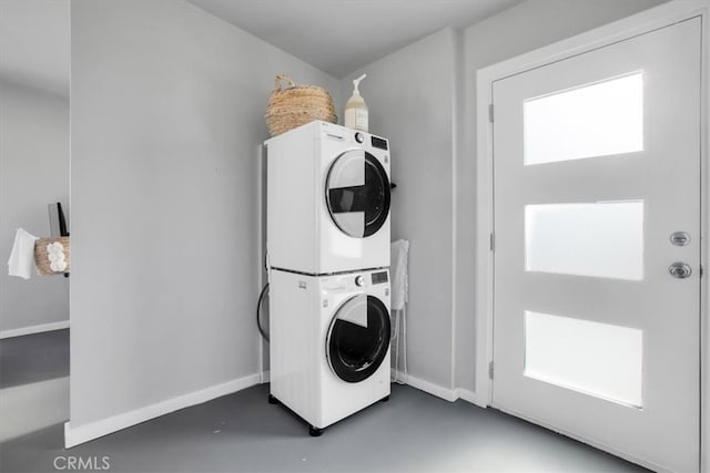 washroom with stacked washer / dryer