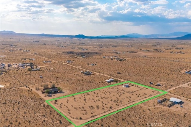 birds eye view of property with a rural view, view of desert, and a mountain view