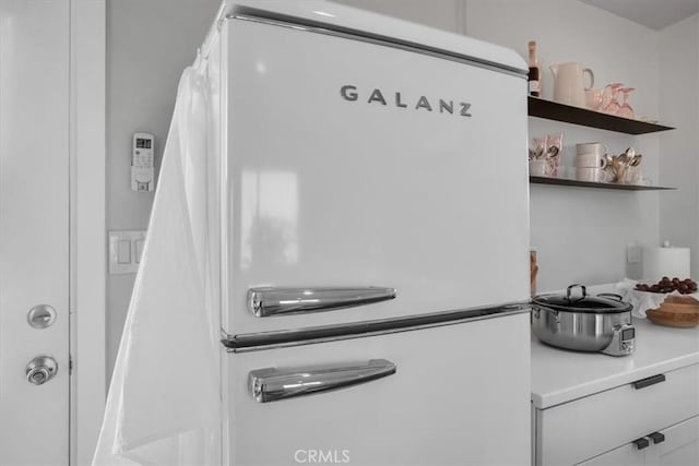interior details featuring freestanding refrigerator