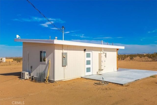 rear view of property featuring a patio area