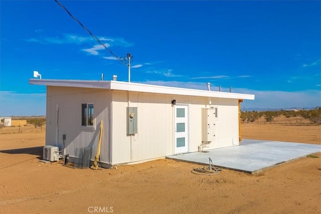 back of house with a patio