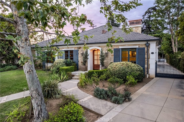 view of front of home with a yard