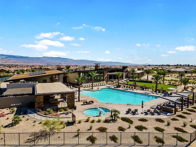 view of pool featuring a mountain view and a patio area